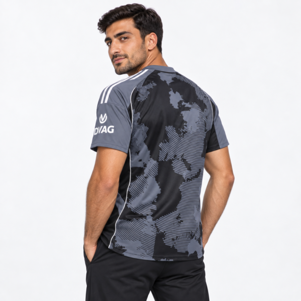 Man wearing Eintracht Frankfurt third football jersey 2025/26 in black and gray.