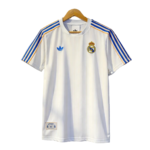 White Real Madrid soccer jersey with blue and gold stripes on the shoulders, Adidas logo on left chest and Real Madrid crest on right chest