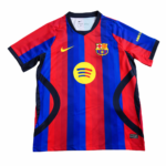 Barcelona football jersey with red and blue vertical stripes, Nike swoosh, club crest, and yellow Spotify sponsor logo on the chest.