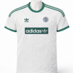 White Adidas soccer jersey with green accents, three green stripes on shoulders, sponsor logo 'adidas' across chest, team crest on left chest.