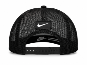Rear view of a black mesh Nike trucker cap with an adjustable plastic snap closure and a rectangular Nike patch on the back.
