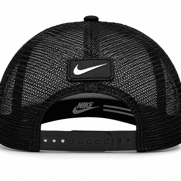 Rear view of a black mesh Nike trucker cap with an adjustable plastic snap closure and a rectangular Nike patch on the back.