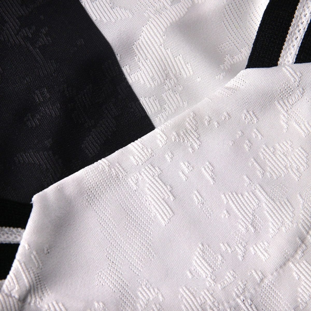 Close-up of black and white patterned fabric with a textured geometric jacquard weave