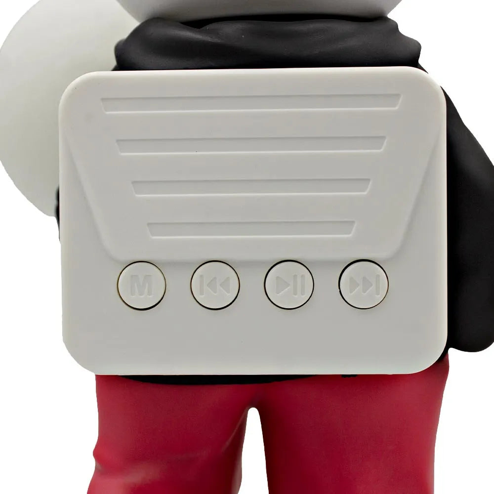 D_NQ_NP_2X_998851-MLM105766453237_012026-F-bocina-lampara-led-inalambrica-astronauta-balon-futbol | UAE SPORT STORE Toy figure with a white portable music player on its chest, four round control buttons labeled M, rewind, play/pause, and fast-forward.