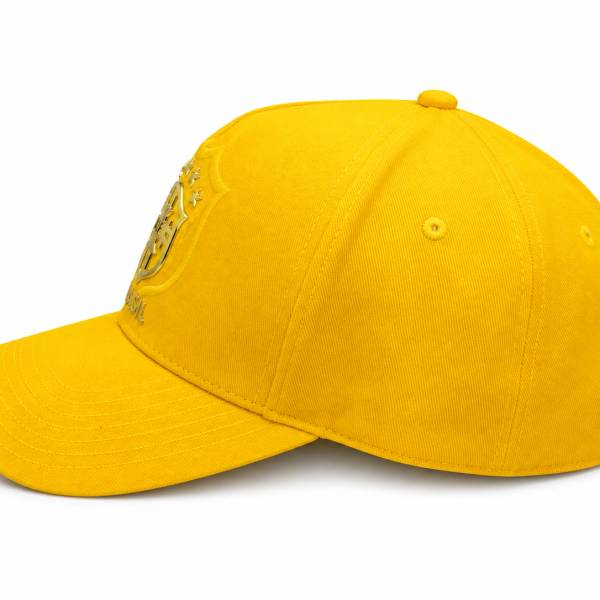 Bright yellow baseball cap with a gold shield emblem on the front panel