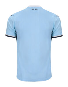 Back view of a light blue polo shirt with a white collar and dark navy sleeve cuffs.