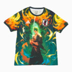 Anime-style graphic T-shirt showing a sword-wielding warrior amid orange flames and green energy, with Adidas logo and Japan badge.