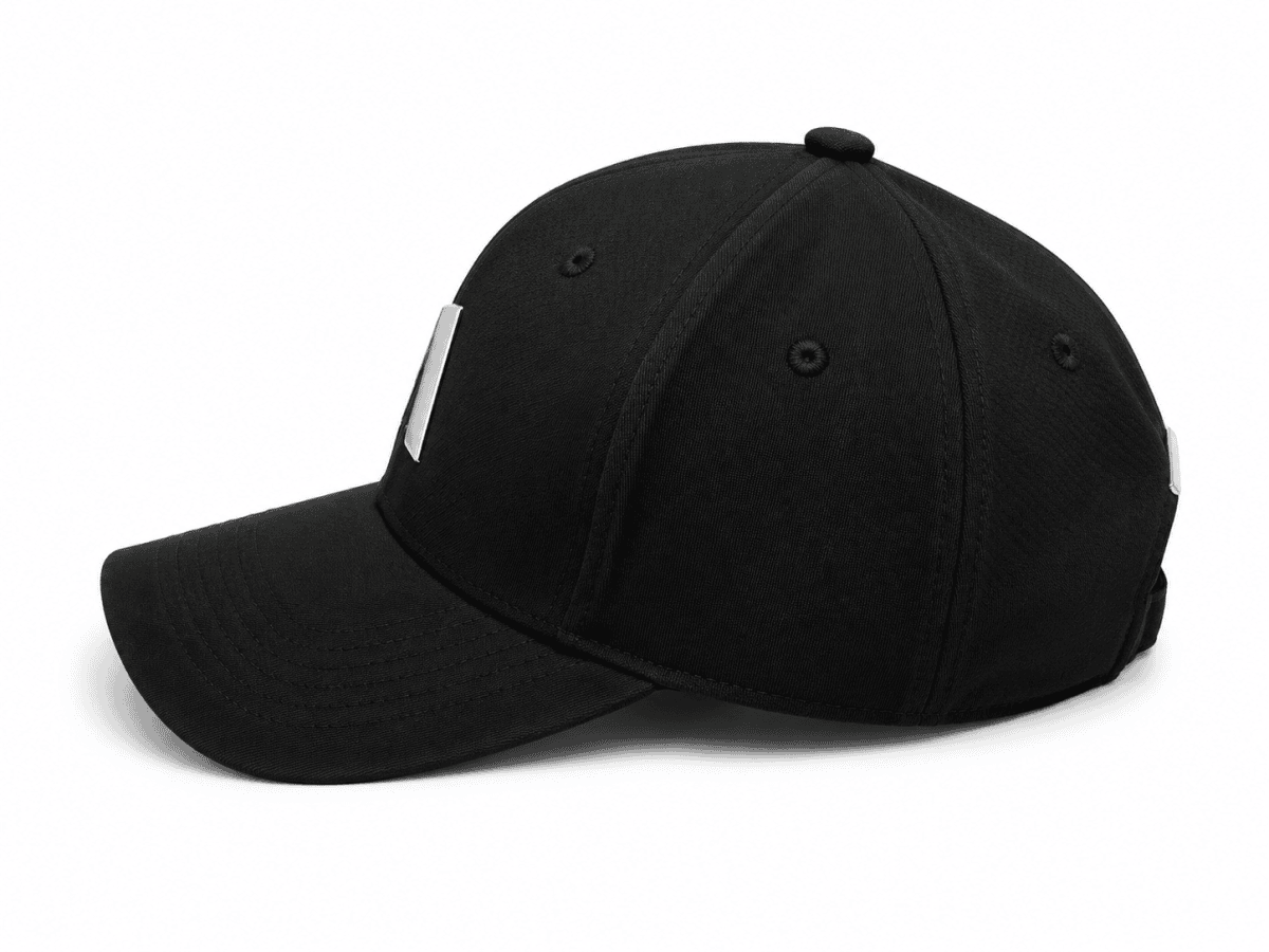 Black baseball cap on a white background with a curved brim and silver side clips/attachments visible on the sides.
