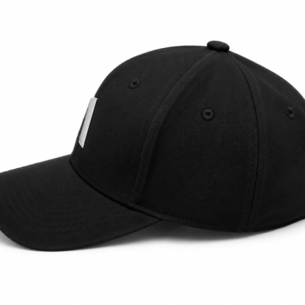 Black baseball cap on a white background with a curved brim and silver side clips/attachments visible on the sides.