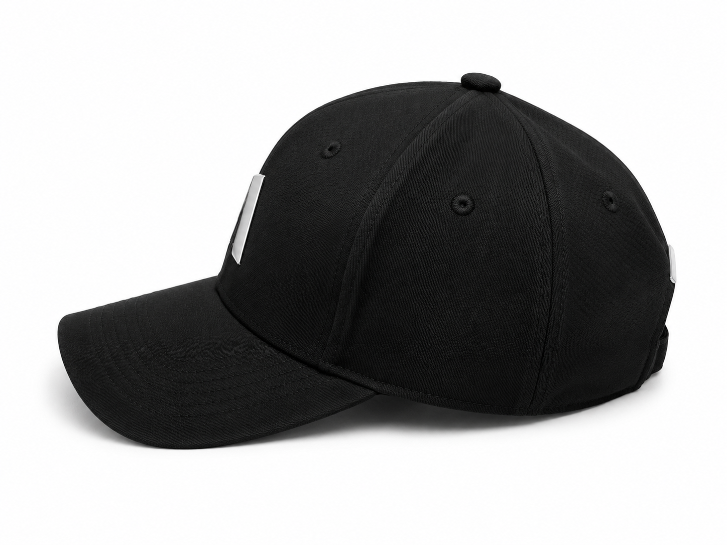 F3677CD0-A2B0-4F8F-96D3-1176756E691D | UAE SPORT STORE Black baseball cap on a white background with a curved brim and silver side clips/attachments visible on the sides.