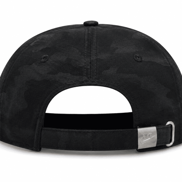 Rear view of a black camo baseball cap with an adjustable strap and metal buckle showing the Nike logo.