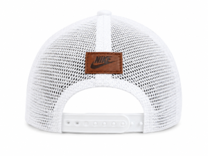 Back view of a white Nike mesh trucker cap with an adjustable strap and brown leather logo patch