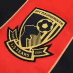 FMCLV13FxKJvKwg | UAE SPORT STORE Close-up of the AFC Bournemouth club crest on a red football jersey, commemorating 125 years (1899–2024).