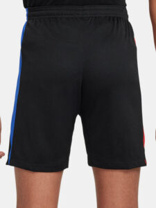 Back view of black athletic shorts with a blue side stripe on a person.