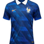 Blue Nike France national team jersey with white collar, gold swoosh, and FFF crest; features diagonal stripe pattern in dark and light blue.