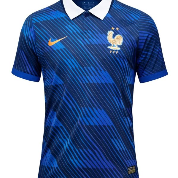 Blue Nike France national team jersey with white collar, gold swoosh, and FFF crest; features diagonal stripe pattern in dark and light blue.