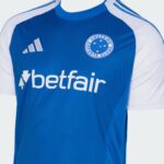 Blue Cruzeiro Esporte Clube jersey with white sleeves, Adidas logo, and Betfair sponsor text on the chest.