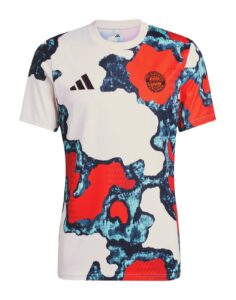 White athletic shirt with blue-red abstract camouflage pattern, Adidas logo on the left chest and FC Bayern Munich crest on the right chest.