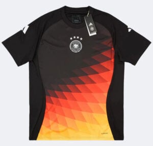 Adidas Germany national football team jersey: black base with orange–yellow geometric gradient pattern on the front, crest with five stars above it, and a attached tag.
