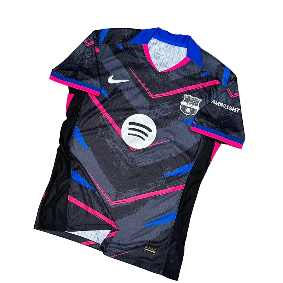 GwGsQUMXYAA8bQV Dark geometric soccer jersey with pink and blue accents, features Nike swoosh, FC Barcelona crest, and Spotify sponsor logo