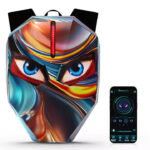 Backpack with a glossy, mask-like artwork and a red LED stripe, shown beside a smartphone displaying a game/app interface.