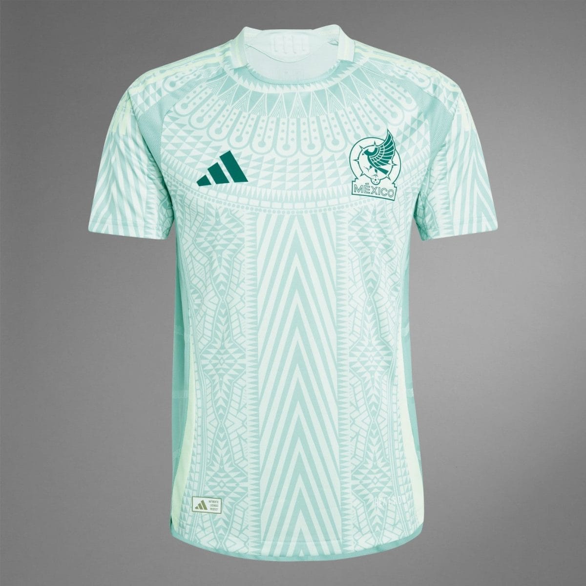 Mint green Mexico national soccer team jersey with an intricate white geometric pattern and team crest on the chest. Adidas logo visible on the other side.