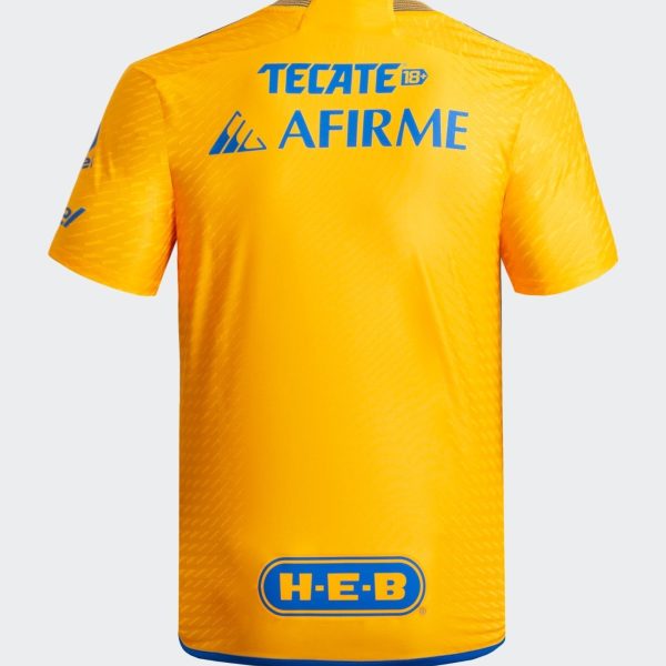 Back view of a bright yellow sports jersey with blue TECATE 18+ and AFIRME logos and a blue H-E-B emblem near the bottom