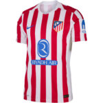 Atlético Madrid home football jersey with red and white vertical stripes, blue Nike swoosh, club crest on chest and Riyadh Air sponsor across front.