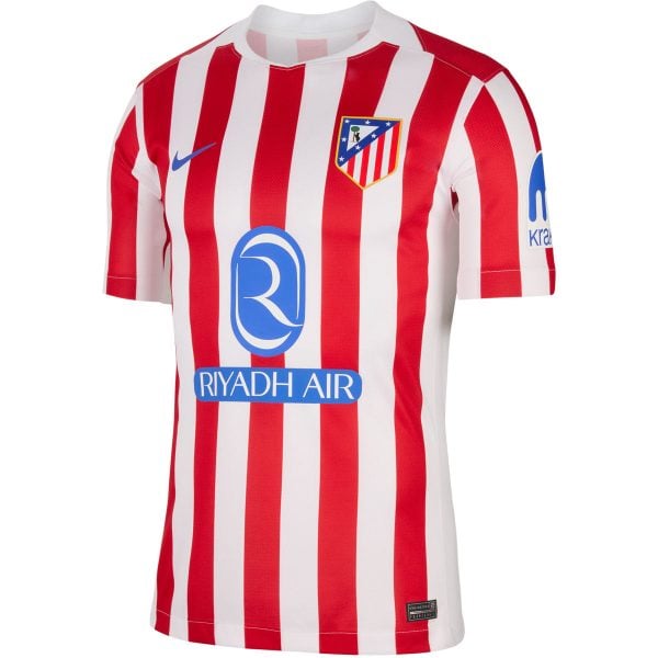 Atlético Madrid home soccer jersey with red and white vertical stripes and Riyadh Air sponsor logo on front.
