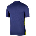 Back view of a royal blue short-sleeve athletic jersey with a yellow side stripe along the right hem area.
