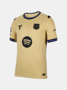 HJ4603-784_431735711_D_A_1X1_48cfc706-a037-4073-aa5a-8abbde823c12 | UAE SPORT STORE Beige FC Barcelona soccer jersey with Spotify logo, team crest, and purple-black trim on neckline and sleeves.