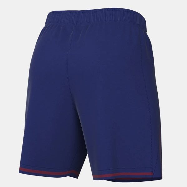 Back view of royal blue athletic shorts with an elastic waistband and red stripe trim at the hem.