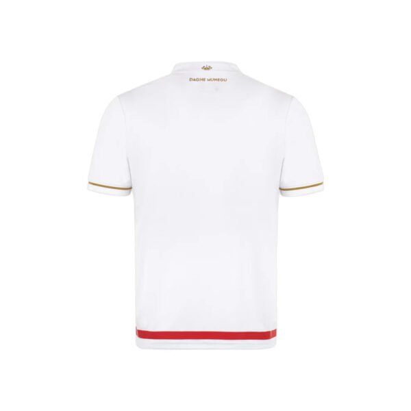 White polo shirt seen from the back with gold piping on sleeves and a red band at the hem.