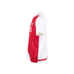 Side view of a red and white soccer jersey with a crest on the chest and white sleeves, showing white side panels and trim.