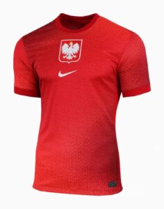 Red Poland national team jersey featuring a white eagle crest on the chest and a white Nike swoosh.