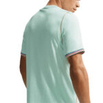 IB5200-394_4 | UAE SPORT STORE Back view of a person wearing a light mint green short-sleeve polo with striped cuffs in red, white, and blue.