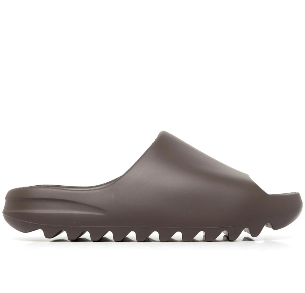 IMAGE-EDIT_ff05b2dd-db42-48a0-b6ee-181fdc843b95 Brown slide sandal with a single strap and a chunky serrated sole.