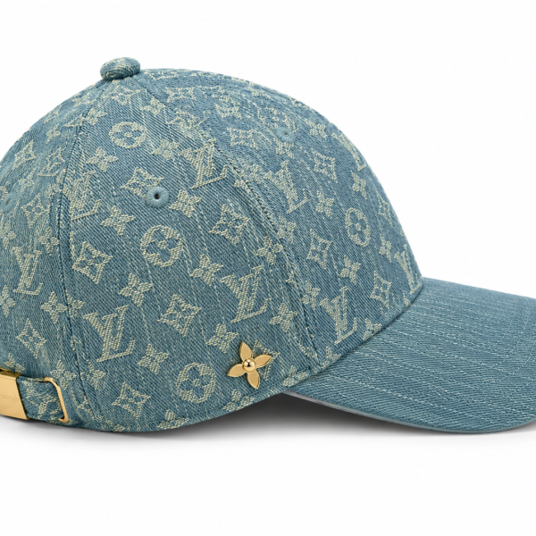 Denim cap with Louis Vuitton monogram pattern, gold back strap buckle, and small gold flower pin edge detail.