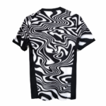 IMG-7432 | UAE SPORT STORE Black-and-white short-sleeve t-shirt with bold swirling optical pattern.