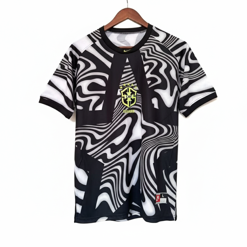 IMG-7433 | UAE SPORT STORE Black and white abstract patterned soccer jersey with Brazil crest on the chest, hanging on a wooden hanger, against a white background.