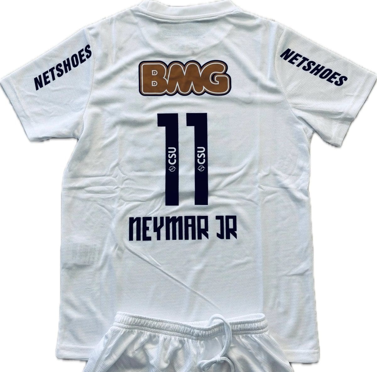White mesh sports jersey with a large BM G logo on the back, NETSHOES text on both sleeves, and dark blue number 11 visible on the back.