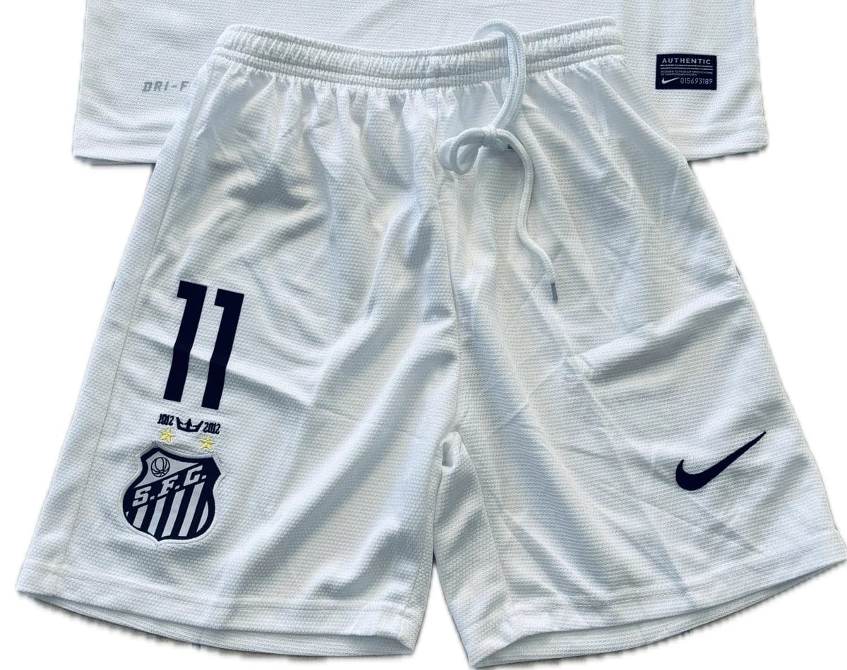 White athletic shorts with a navy number 11 on the left leg, a shield crest on the left thigh, and a drawstring at the waist.