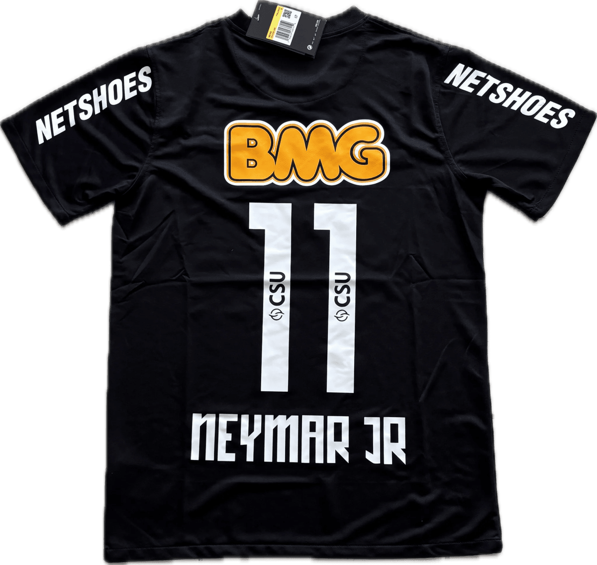 Black athletic jersey with 'NETSHOES' on both sleeves, an orange outlined 'BMG' logo on the chest, and white vertical strips down the front; tag at the collar.