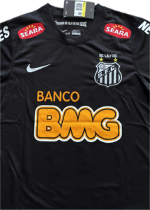 Black soccer jersey with Seara sponsor patches, white Nike swoosh, and a crest reading S.F.C. with 1912–2012 and stars on the chest.