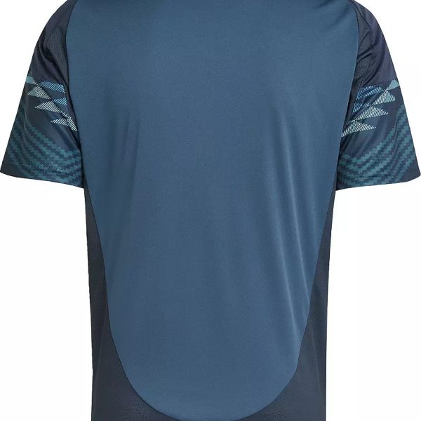Back view of a blue athletic jersey with navy side panels and teal chevron pattern on the sleeves.