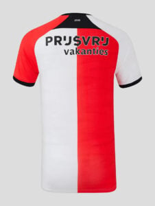 Back view of a red‑and‑white vertical‑block sports jersey with black sleeve cuffs and collar trim, featuring the text 'PRJ$VRJ vakanties' across the upper back.