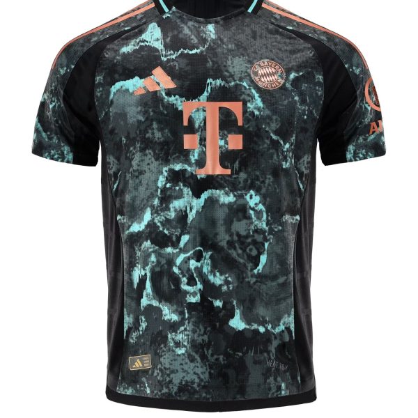 Front view of a Bayern Munich soccer jersey with turquoise-black camo pattern, pink Adidas logo, and large pink T-Mobile sponsor on the chest.