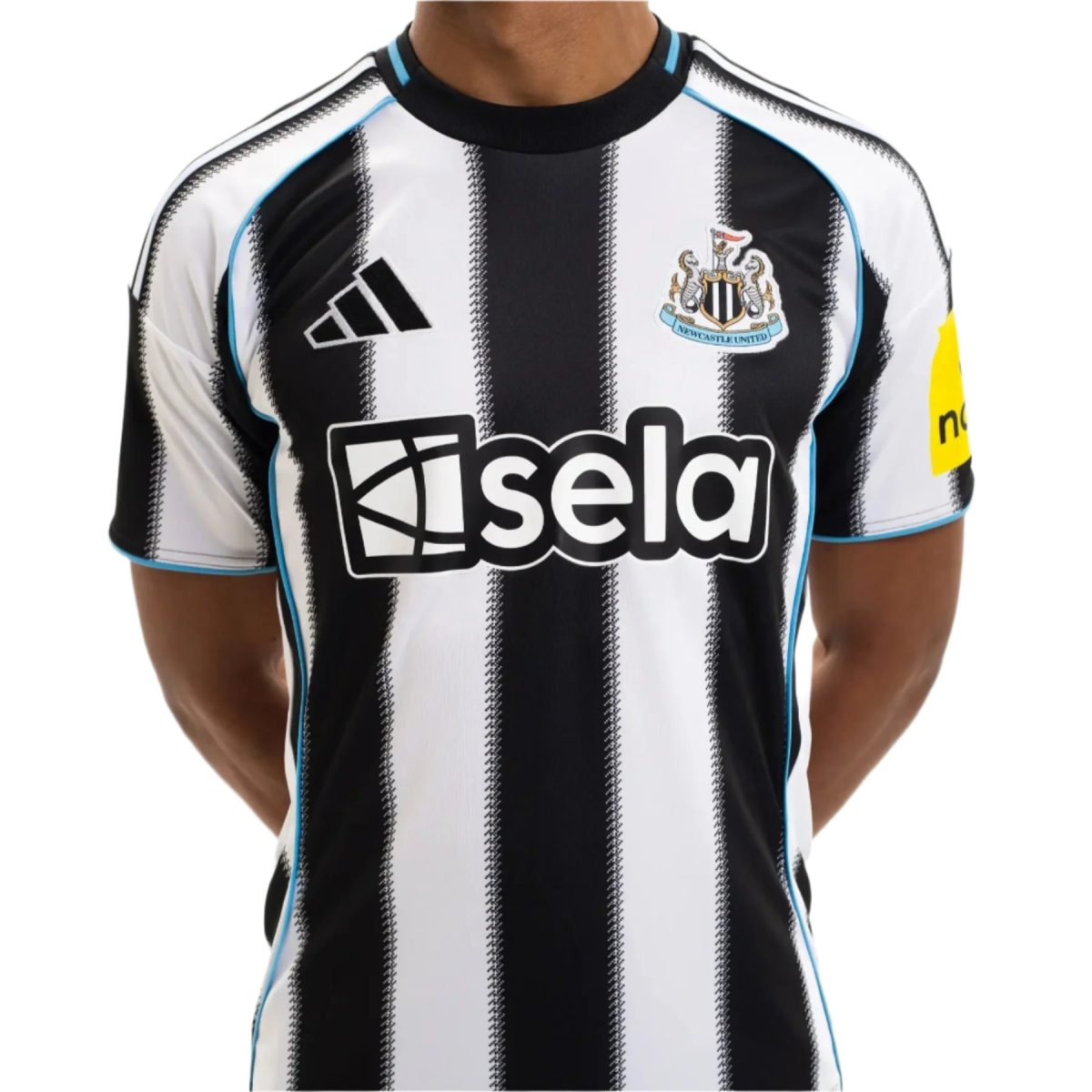 Close-up of a Newcastle United football jersey with black and white vertical stripes, showing the Adidas logo and club crest on the chest.