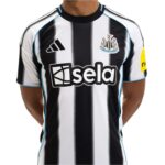 Close-up of a Newcastle United football jersey with black and white vertical stripes, showing the Adidas logo and club crest on the chest.
