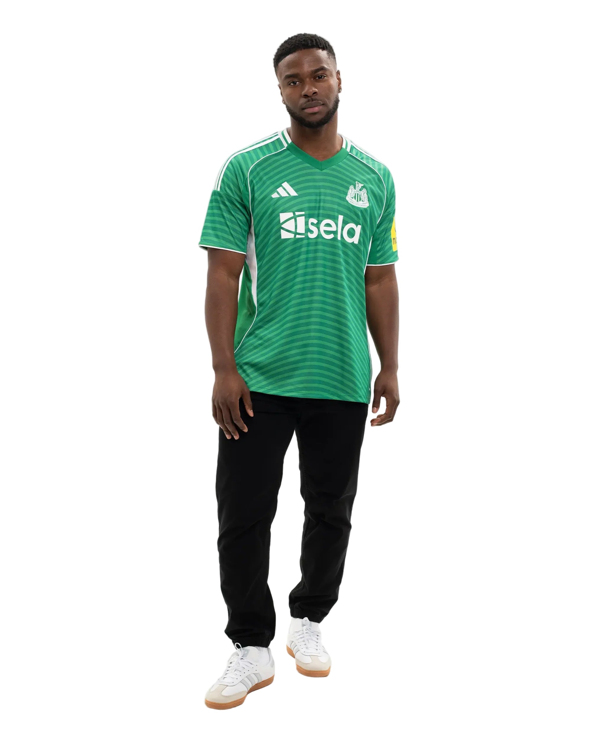 JJ2245_MOD_6 | UAE SPORT STORE Man wearing a green striped soccer jersey with white logos, black pants, and white sneakers against a white background, facing forward.